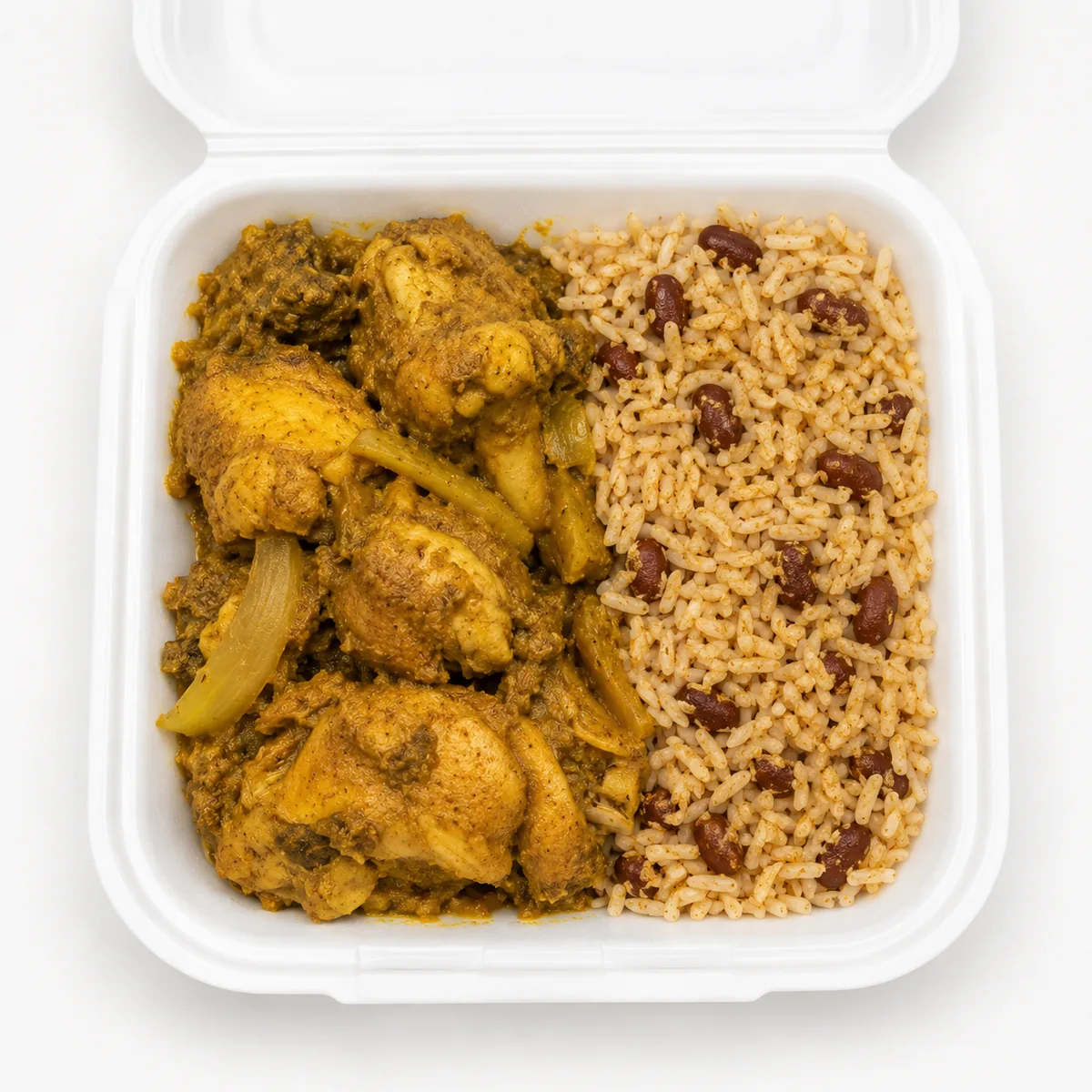 Curry chicken meal in a white takeout container
